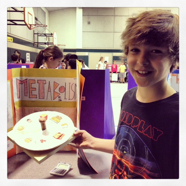 Otto at 5th grade Health Fair with final project on Metabolism