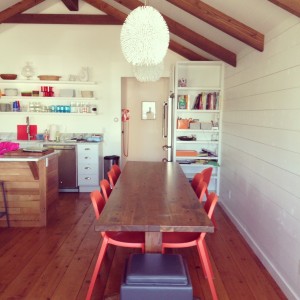 Kitchen, dining area with table made out of ceiling beams!