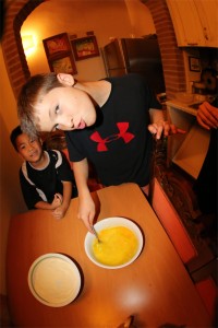 Otto and Jones mixing the eggs and readying the flour for dough making!