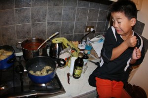 Jones putting raviolis in the boiling water