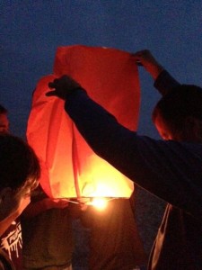 Trying to light lanterns on Cannon Beach