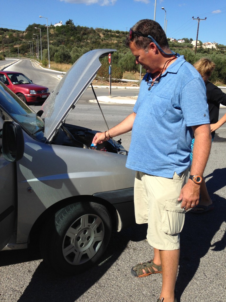 Dad putting water in the radiator to cool it off... just another thing to add to the craziness!